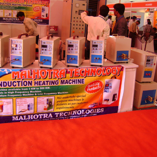Exhibition stall of Malhotra Technologies with induction heating machines